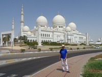 2018.06.03 With Sheikh Zayed Grand Mosque in the background – one of the biggest mosques in the world, which we could not get into.