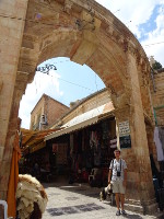 2018.09.09 Under the arch of the entrance to the Aftimos Market in the Muristan area of the Christian Quarter in the Old City of Jerusalem.