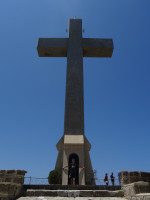 2019.06.05 Such a little man as compared to the huge 18-meter high concrete cross on the Filerimos hill.