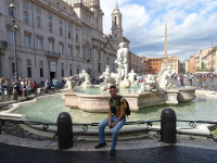 2019.10.03 Sitting on the fence of the Moor Fountain (Fontana del Moro) in Navona Square (Piazza Navona) in Rome.