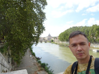2019.10.03 Against the background of the Tiber flowing through the eternal Rome to Saint Peter's Basilica in Vatican (in the distance).