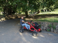 2019.10.04 Passenger-“engine” of a 2-seat bicycle cart (the 2nd, driver, is taking the picture) in the park of Villa Borghese (Rome, Italy).