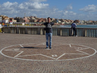 2019.10.05 An 8-ray wind rose (a pointer of the cardinal directions) on the Tyrrhenian Sea (mar Tirreno) embankment in the town of Lido di Ostia (a district of Rome).