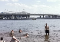 2021.07.11 Swimming in the Neva Bay of the Gulf of Finland against the background of the “GazProm Arena” stadium and the Western High-Speed Diameter.