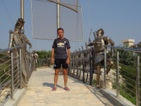 2021.07.29 On an iron bridge with some iron sculptures in the Ayia Napa Sculpture and Cactus Park.